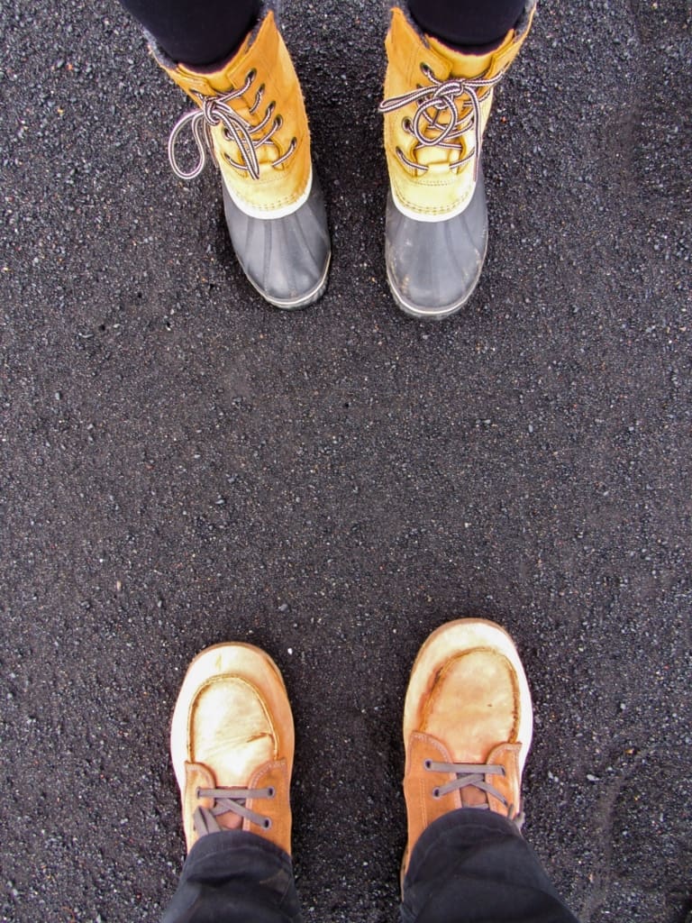 Standing at the black sand beaches in Iceland