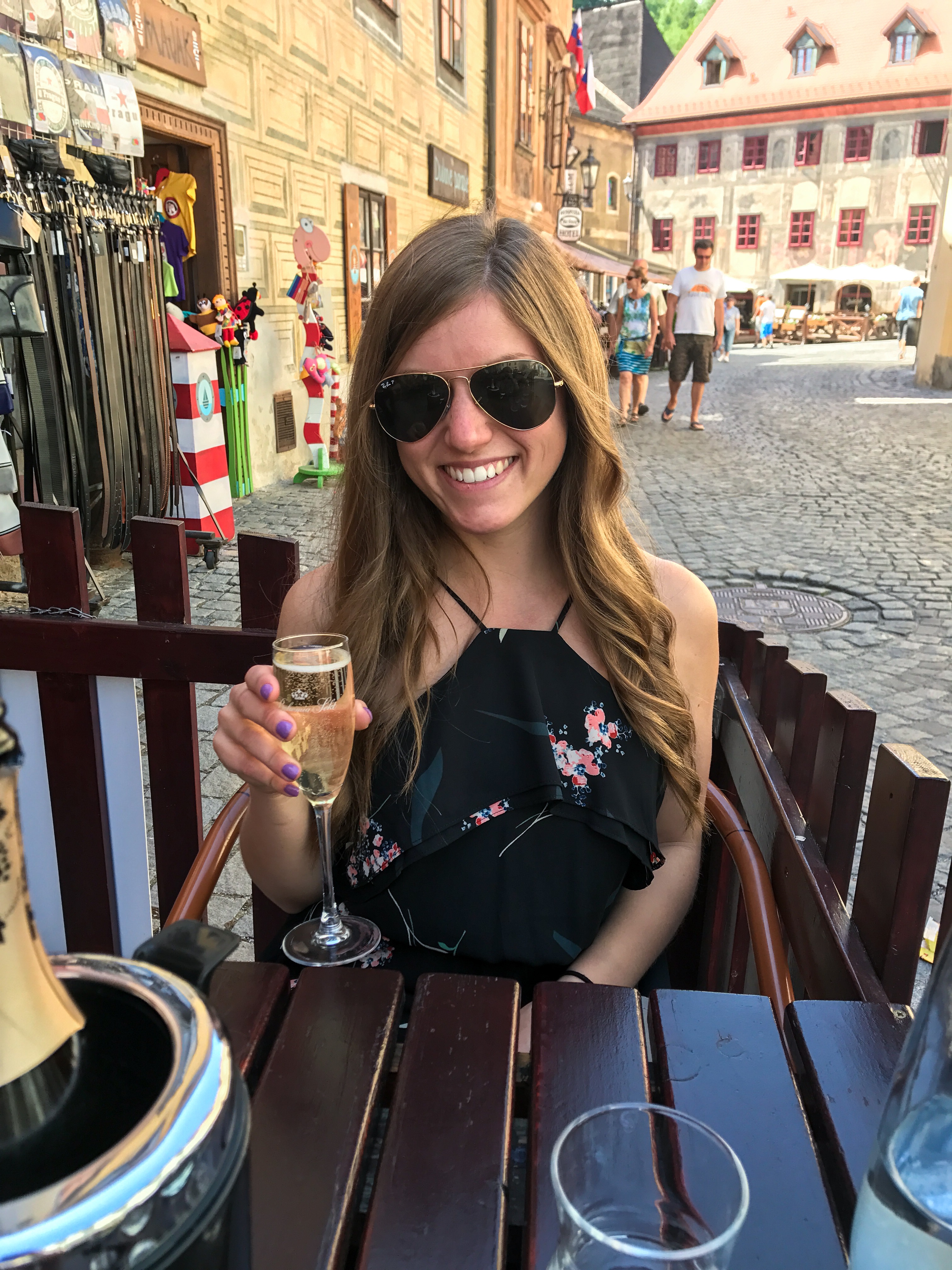 Drinking champagne in the streets of Cesky Krumlov