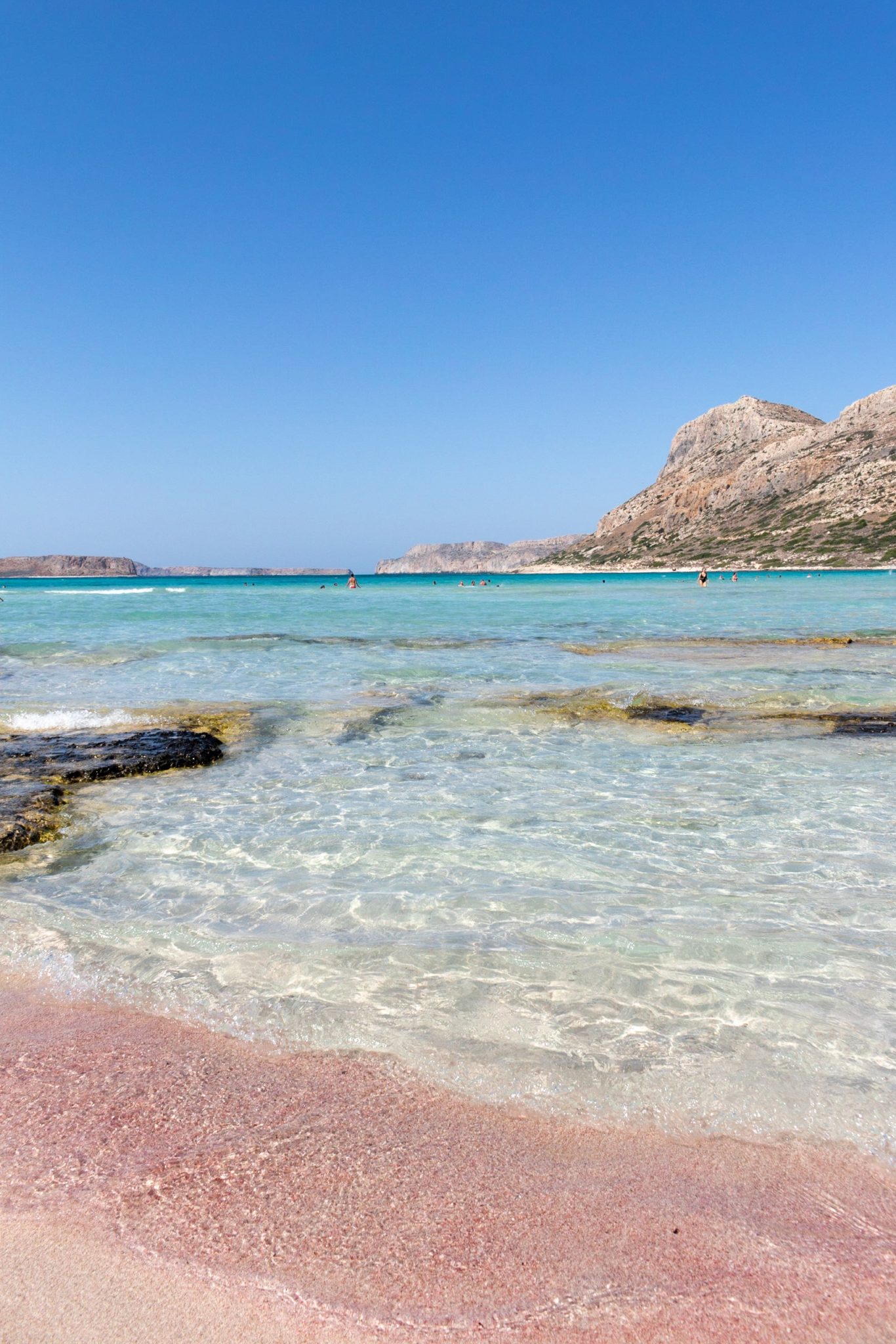 Photo of the pink sand in Balos, Greece