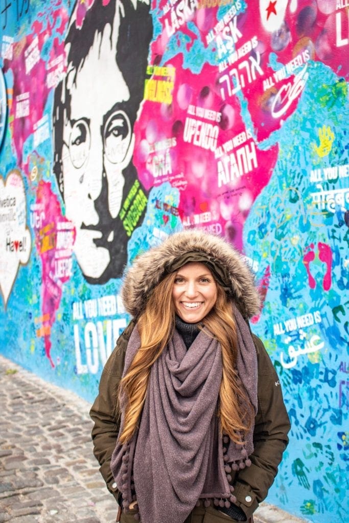 Posing in front of the John Lennon wall in Prague