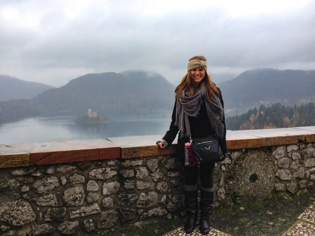 Posing for a photo with Lake Bled in the back