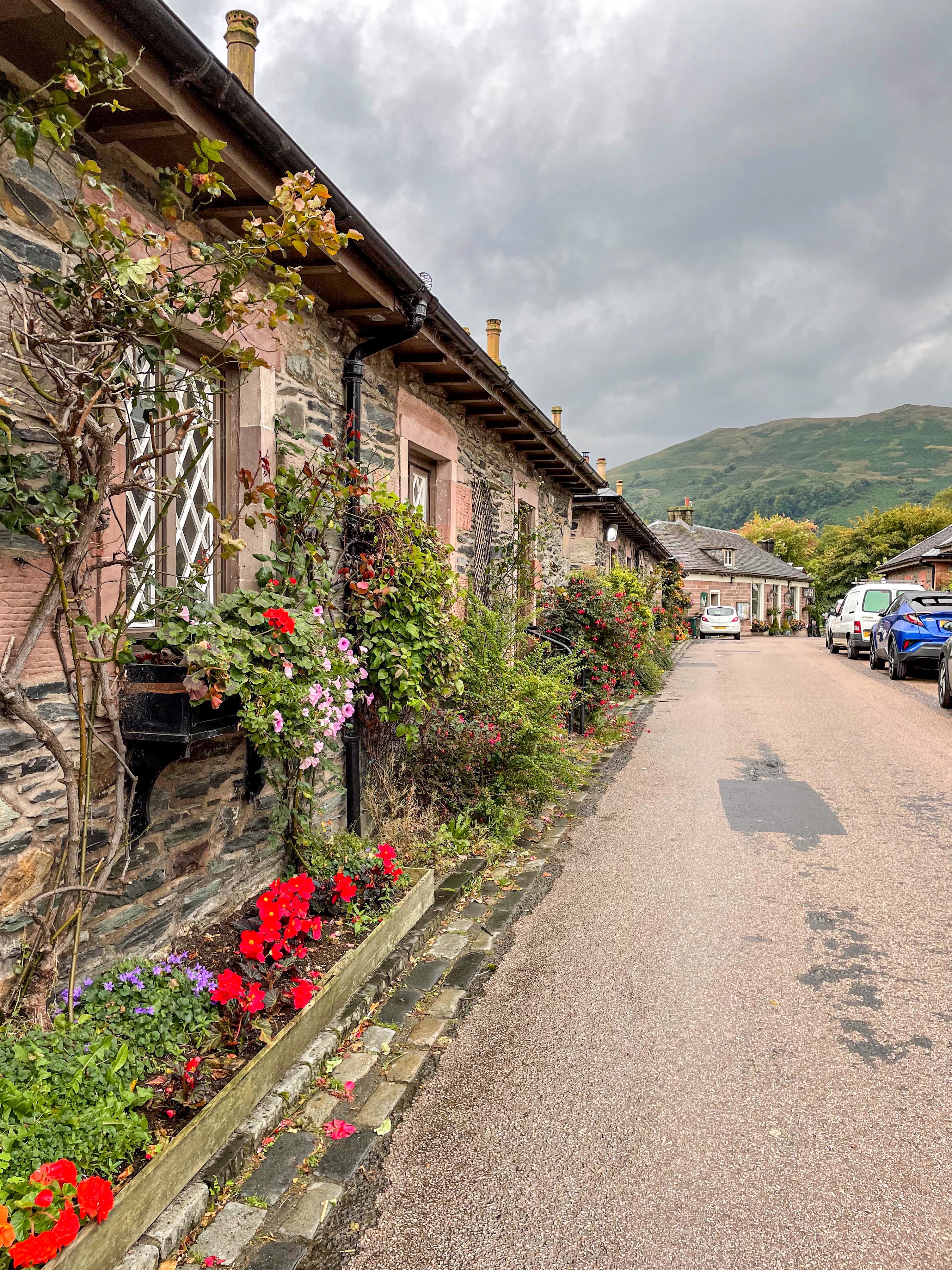 Scenic shot of the cottages along the street in Luss Scotland