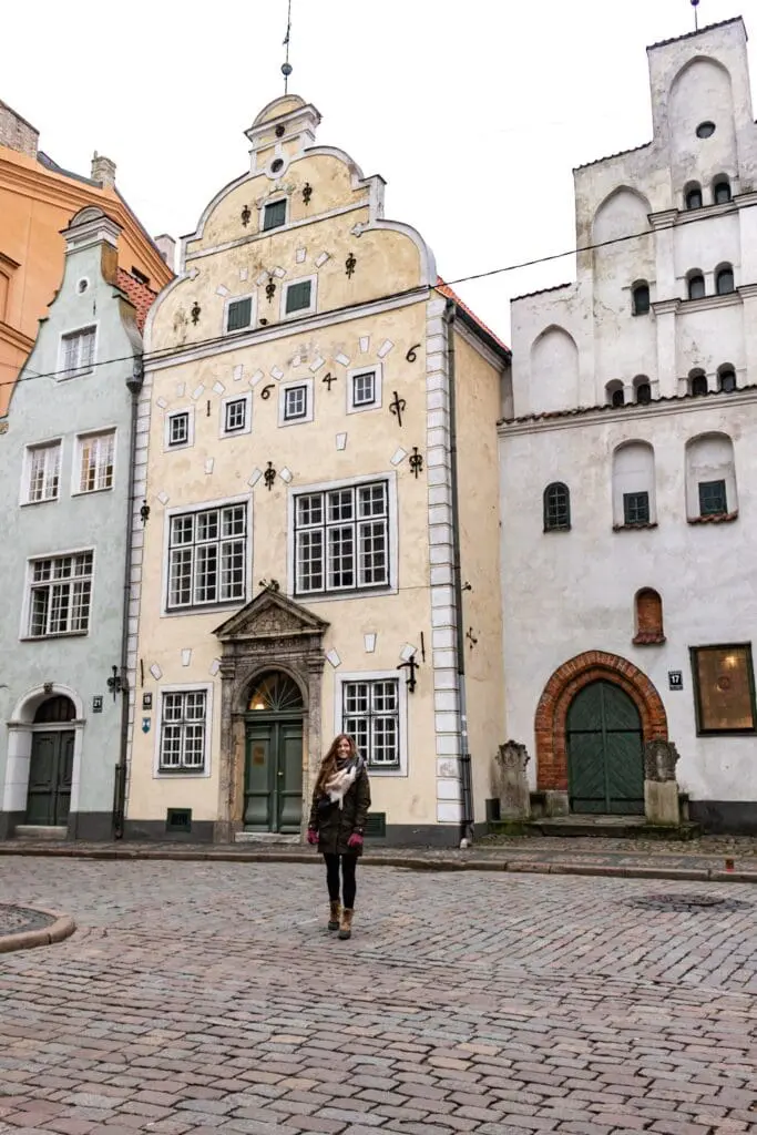 Posing in front of the three brothers in Riga, Latvia