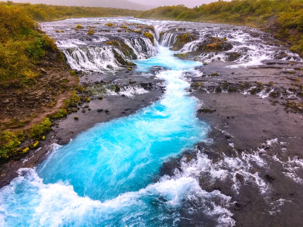 Scenic shot of the piercing blue water at Bruarfoss in Iceland