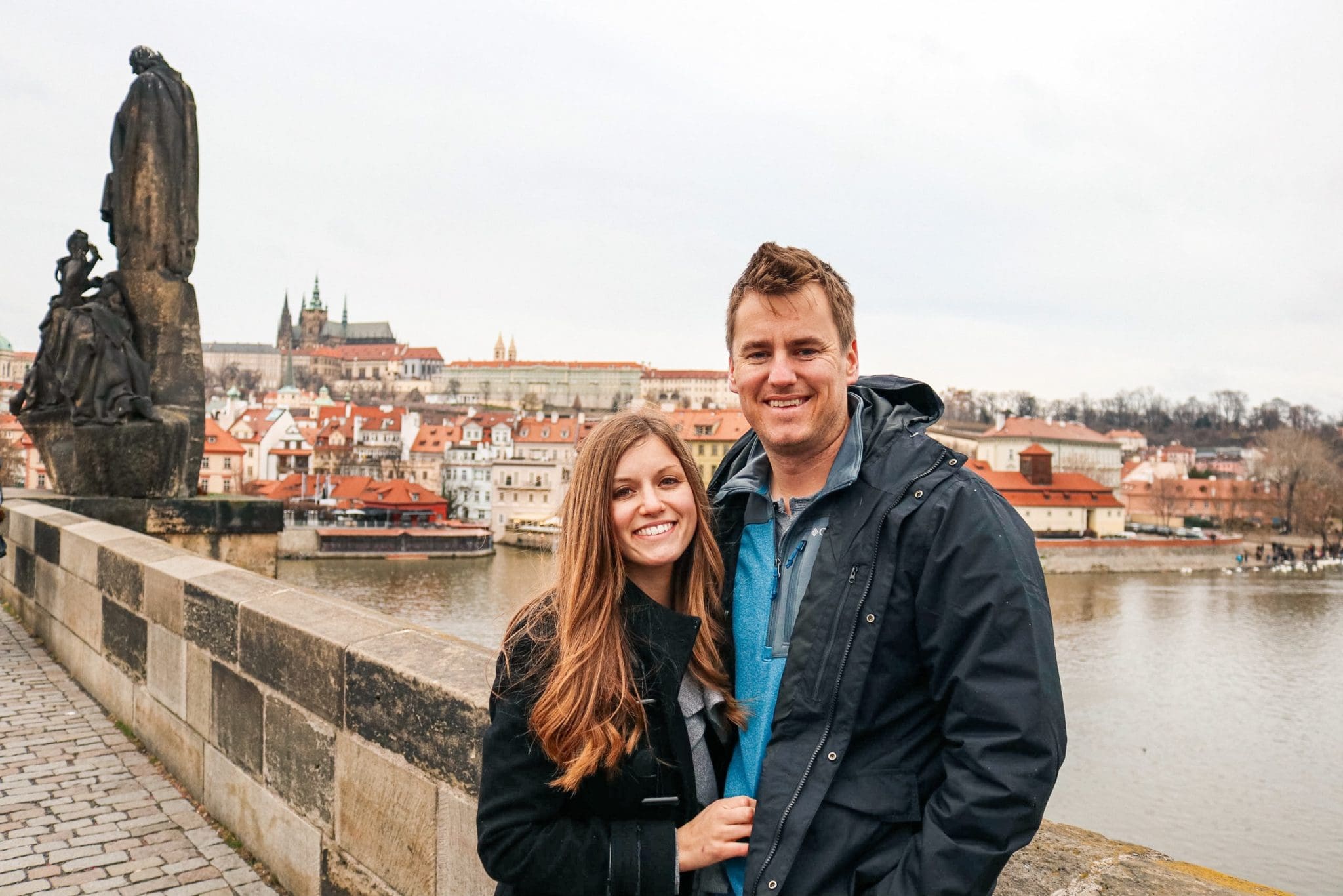 Posing for a photo with my husband on Charles Bridge