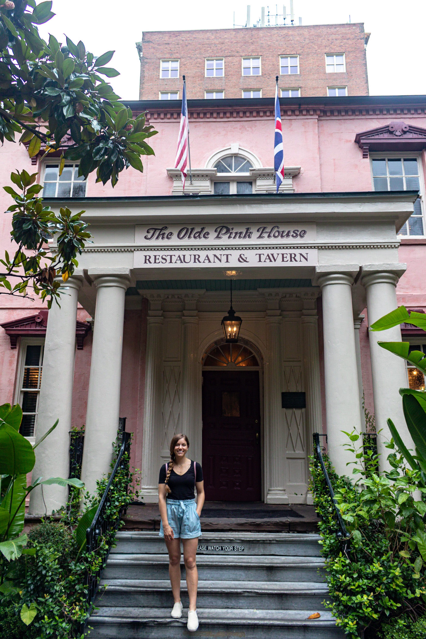 Posing in front of the Pink House in Savannah GA