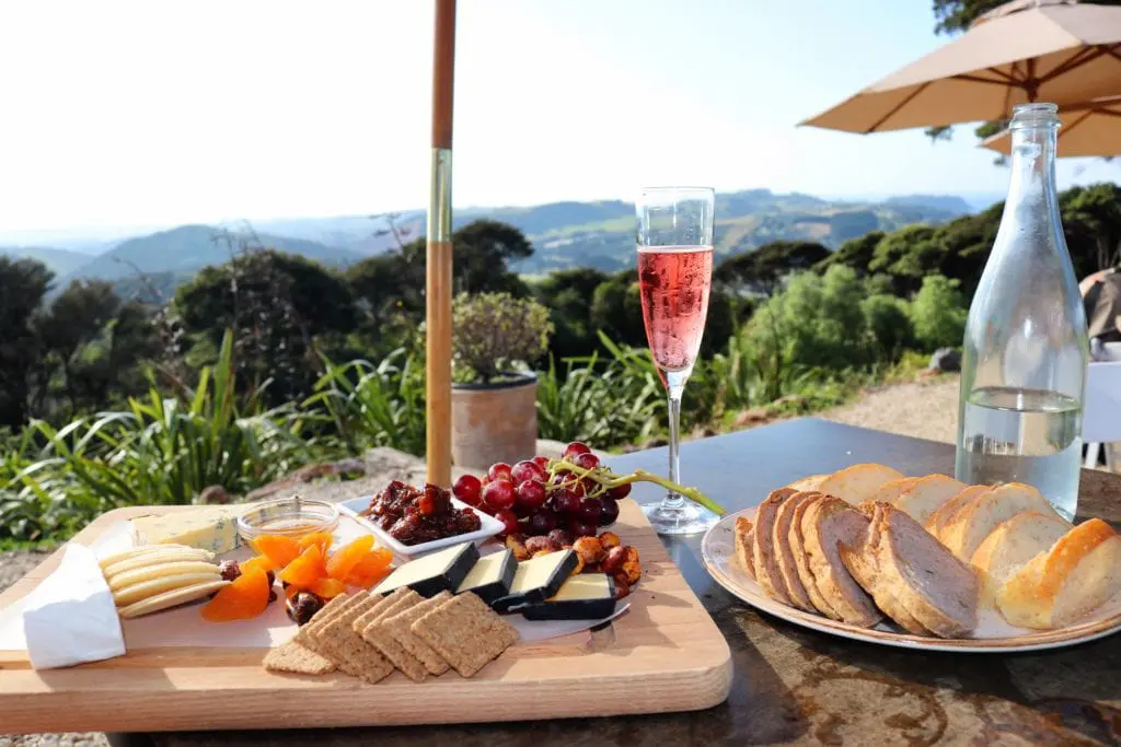 Photo of a cheese plate and rose from Batch Winery on Waiheke Island