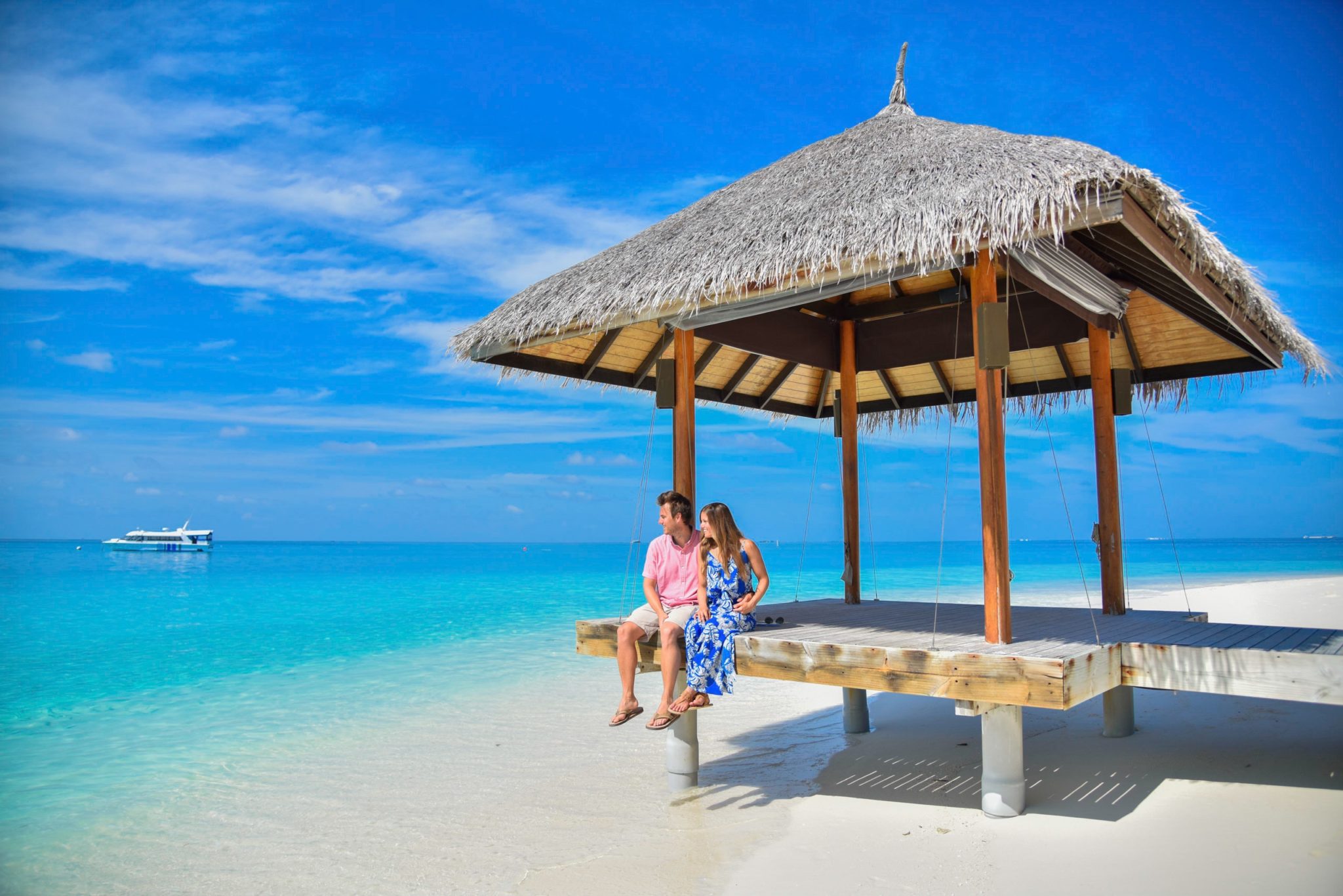 Sitting on the dock soaking in the crystal clear water in The Maldives